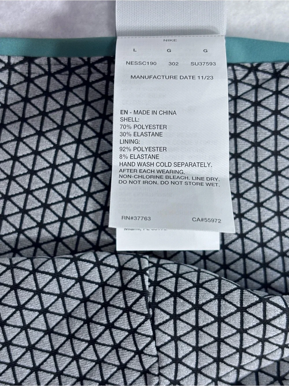 Nike Teal Swim Briefs with Geometric Lining